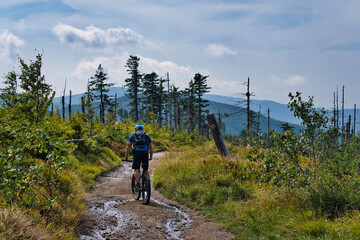 Fototapeta na wymiar cyclist is riding a bicycle on a mountain peak