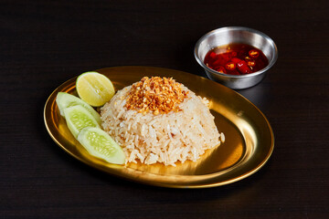 Garlic oil fried rice serve on gold stainless dish