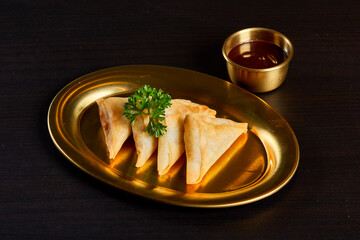 Banana samosa with chocolate sauce