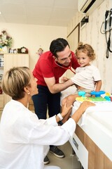 Happy male doctor have fun cheer support boys patients at visit to clinic with mom. Children healthcare concept.
