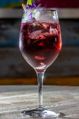 red cocktail with sparkling wine aperol whiskey juice bar