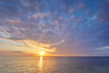 Sky background and water reflection on sunset.