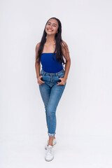 A young Filipino woman in a blue tube top and jeans. Full body photo isolated on a white background.