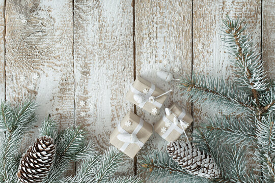 Christmas gifts on old wooden background