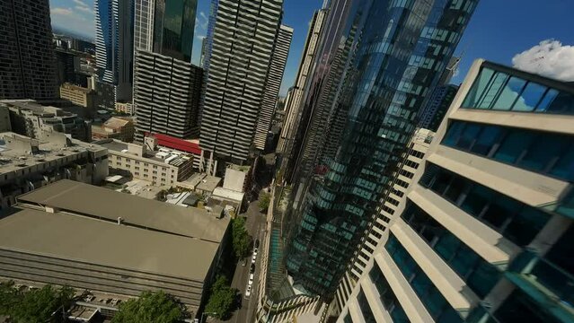 Flying through skyscrapers in the business center of Melbourne