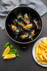 Delicious seafood mussels with parsley sauce and lemon. Delicious steamed mussels.