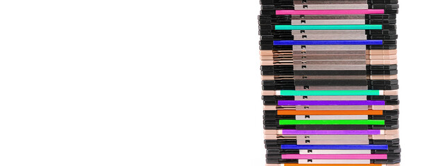stack of old 1.44 inch floppy disks used to save computer data