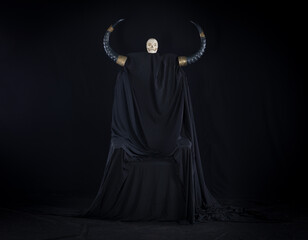 black throne devil on a black background