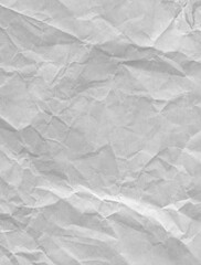 A crumpled and wrinkled white paper texture. vertical image