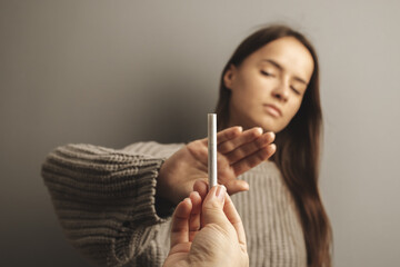 stop smoking minors, teenager refuses cigarettes, tobacco ban, harm to health