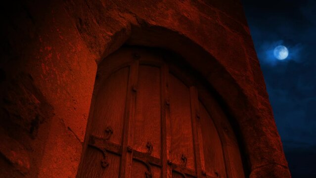 Medieval Door In Firelight With Moon Above