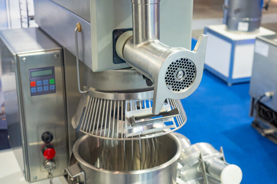 Industrial food mixer. Meat grinder for food production. Industrial equipment for kitchen of food enterprise. Technologies for catering. Industrial machine for kneading text. Huge mixer for catering