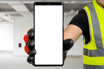 Phone in builder hand. Smartphone mock up. Cellphone with blank white screen. Construction...