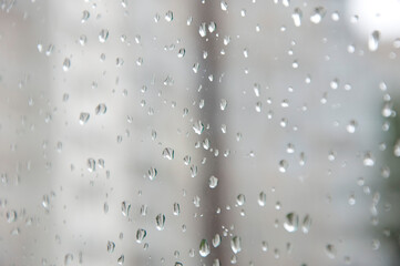 rain drop background. raindrop in autumn weather. rainy water surface on glass. wet rain drop background. droplet on window or condensation. gray bubbles