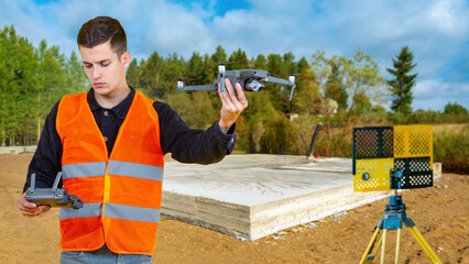 Man surveyor with quadrocopter. Guy launches surveying drone. Man is holding quadcopter remote...