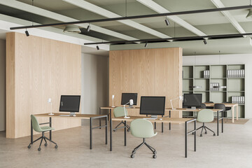 Cozy coworking interior with office furniture and pc computers in row