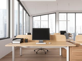 Modern coworking interior with workspace, desk and pc screen, panoramic window