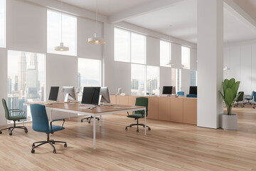 Cozy office interior with pc desktop and sideboard with panoramic window