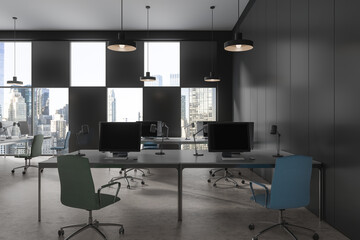 Grey office interior with pc monitors and tables in row, panoramic window