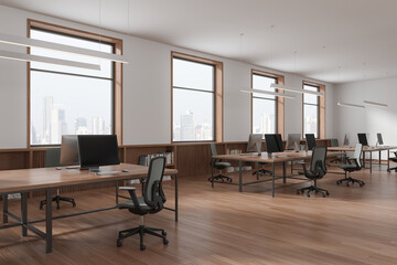 Stylish workspace interior with desk and chairs, sideboard near panoramic window
