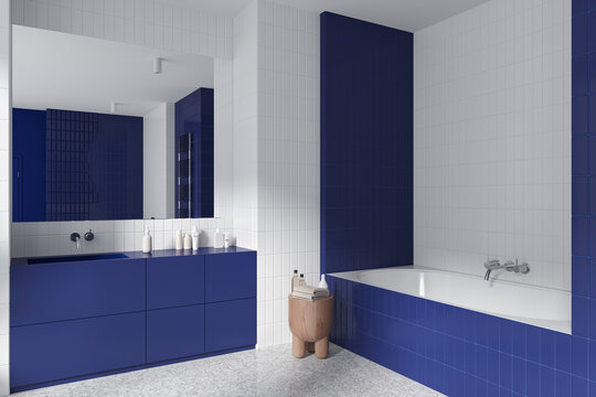 White and blue bathroom corner with sink and tub