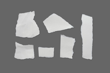 Recycled paper craft stick on a gray background. Set of paper torn on gray, White paper torn or ripped pieces of paper isolated on gray background with clipping path.