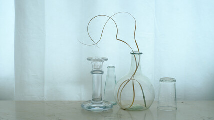 four glass objects and dried grass, home decor, negative space,seasonal decoration