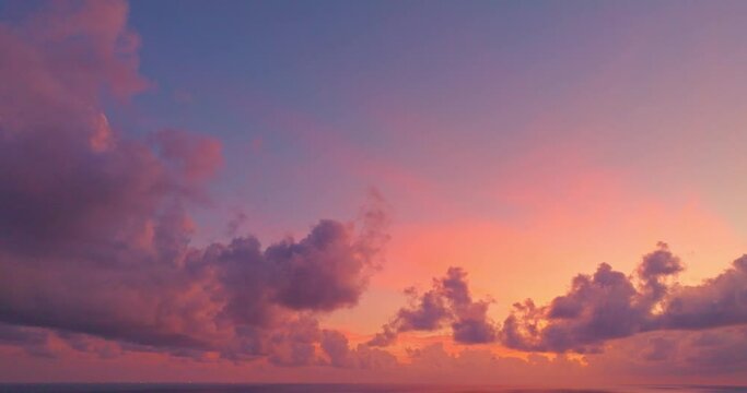 .Aerial view Beautiful pink cloud in sunset above the ocean..The bright sunlight in the evening looked strangely beautiful. .Gradient color. amazing colorful cloud scape background. .
