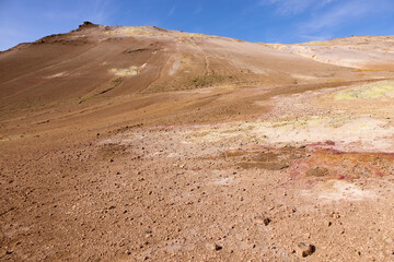 Hverir, Iceland. A surreal, bare orangy-red, geothermal area at the foot of Namafjall. Full of fumaroles, mud pools, steam vents. It's on Route 1. It is also called Namaskard Hverir.