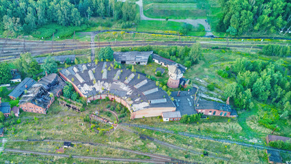 Aerial view of an abandoned locomotive repair facility.