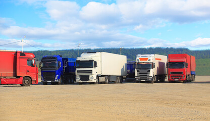 Trucks in a parking lot outside the city