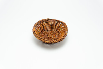 Fototapeta premium wicker basket isolated on white. Empty wooden fruit or bread basket isolated on white background