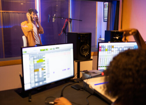 Black woman recording in studio