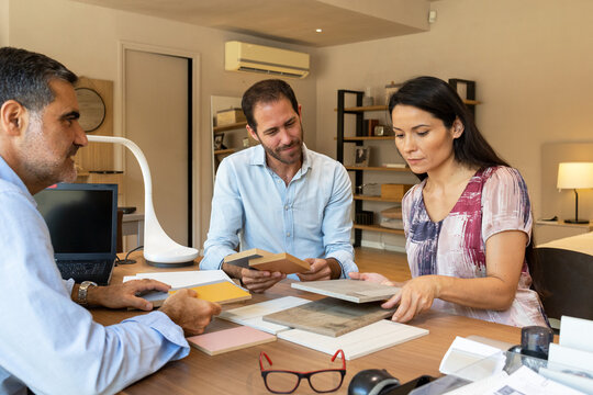 Married couple choosing color of furniture