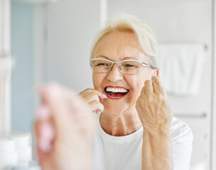 woman tooth bathroom hygiene senior morning routine floss dental care oral mouth product white thread brushing elderly home retirement mirror health cleaning
