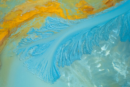 Textured backdrop of yellow mineral surface