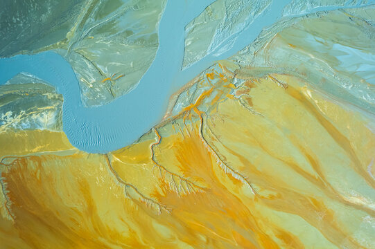 Textured backdrop of yellow mineral surface
