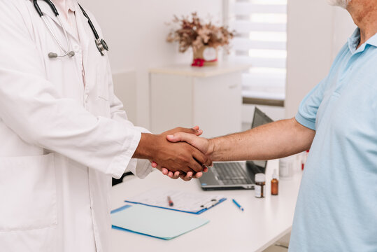 Anonymous Diverse Doctor And Patient Shaking Hands