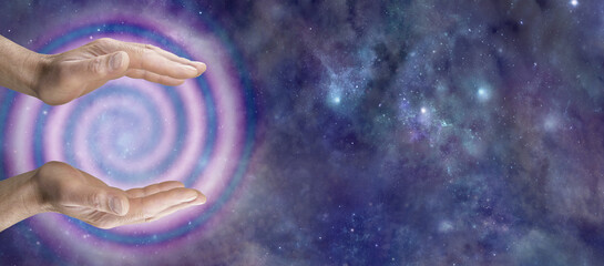 Reiki Master Healer sensing awesome vortexing energy - male cupped hands and spiralling pink energy...