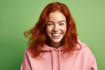 Fototapeta premium cute smiling freckled redhead girl in a fashionable dress
