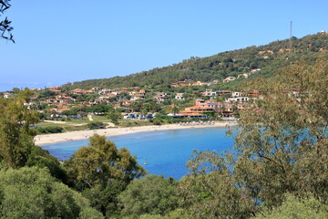 Fototapeta na wymiar view from the San Gemiliano tower on the rocky coast on the blue sea. Sardinia, Italy. City of Arbatax