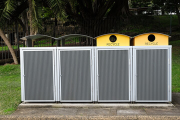 Recycle bins and other waste bins in a garden.