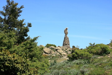 Statua San Michele on top of sardinian mountain landscape near Biddamanna Istrisàili/Villagrande...