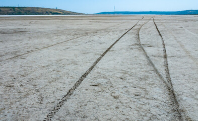 Salt on the surface of therapeutic mud, extraction of medical mud in a body of water drying up due to climate change - Kuyalnik estuary, Odessa region, Ukraine