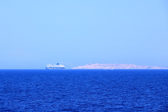 May 27 2023 - Santa Teresa Gallura, Sardinia, Italy, Mediterranean sea: Large Grimaldi Lines RoRo (Roll on/off) vessel cruising the Mediterranean sea