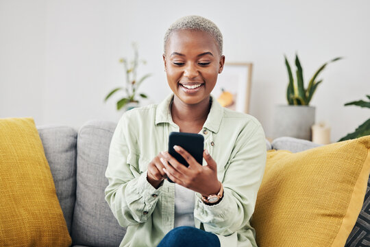 Phone, home or happy woman online to chat for communication, texting or social media. Reading news, smile or African person typing on mobile app to scroll on dating website or digital network on sofa