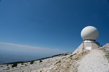 The Radôme on the top of the Mont Ventoux in Vaucluse, a civil aviation radar. A blue and cloudy sky.