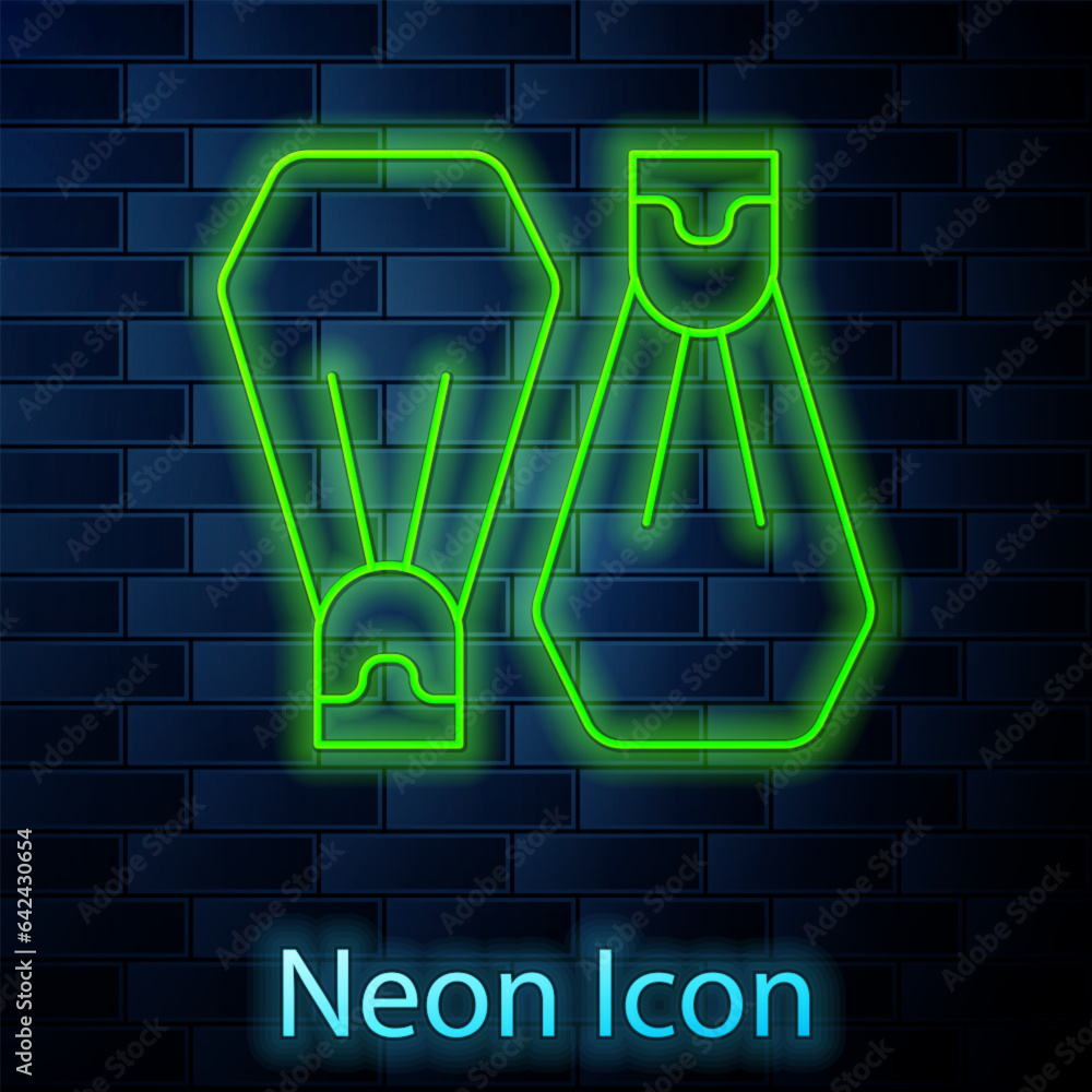 Wall mural glowing neon line rubber flippers for swimming icon isolated on brick wall background. diving equipm