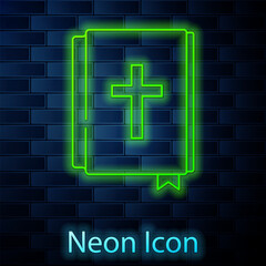 Glowing neon line Holy bible book icon isolated on brick wall background. Vector