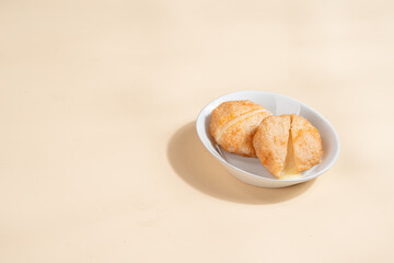 Pempek is a savoury Indonesian fishcake delicacy, made of fish and tapioca from Palembang. Pempek is served with sweet and sour sauce.